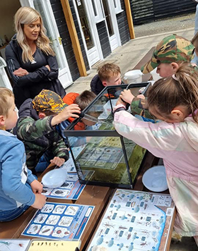 Children and adults at The Antrim Fly Fair 2022 - Entomology Display