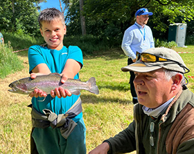 Catching a fish at the Antrim Fly Fair 2022 